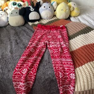 red and white christmas leggings in good condition size is s